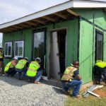 Teaching CBG Interns How to Install Vinyl Siding